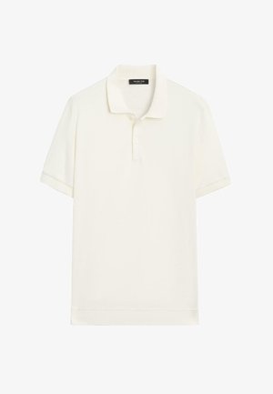 Polo crème clair en tissu doux, avec col classique, patte à deux boutons et manches courtes. Texture lisse ; design minimaliste.