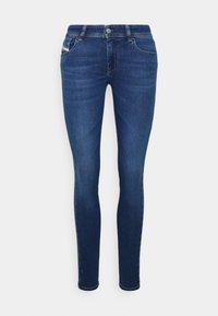 Džínové kalhoty s tmavě modrým odstínem, úzký střih, design s pěti kapsami a jemným efektem vyšisování. Mají kovové tlačítko a zip.