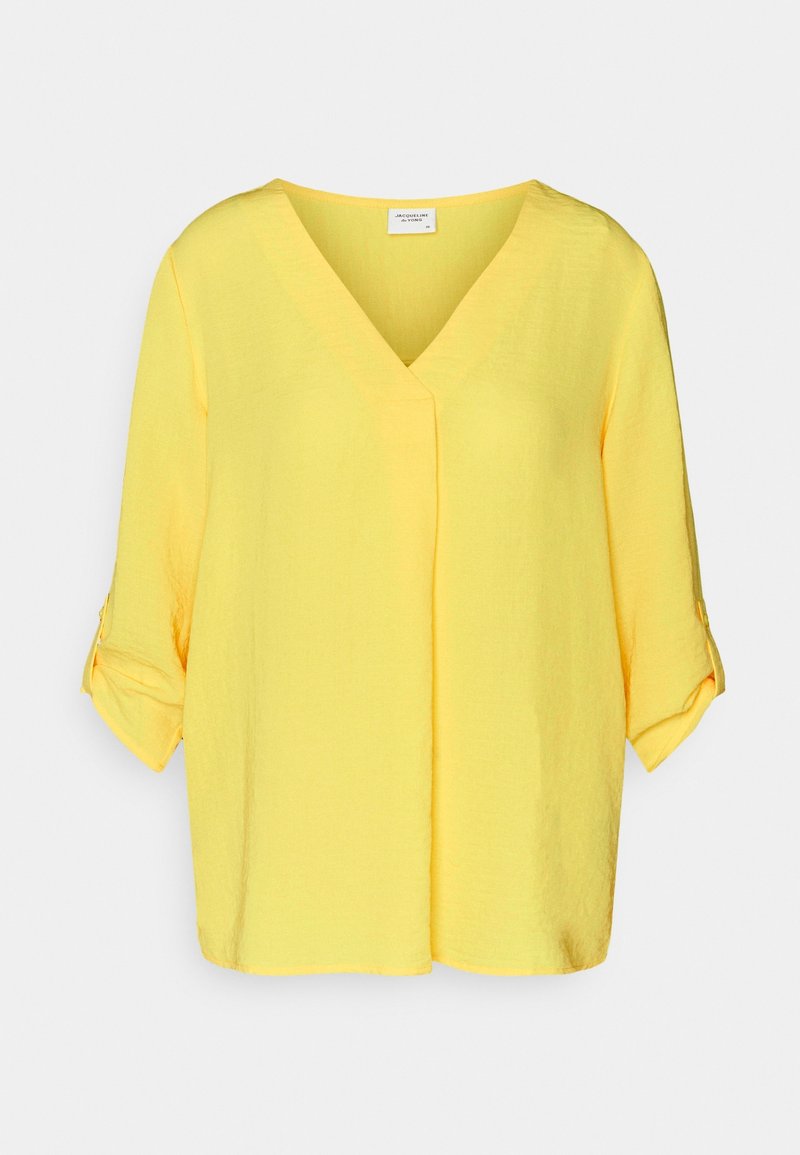 Blouse jaune avec un décolleté en V et des manches courtes à revers. Fabriquée en tissu léger, elle présente une coupe décontractée et des coutures minimales.