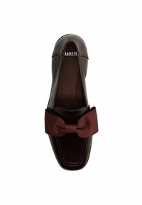 Dark brown leather loafer with square toe, stitched detailing, and a large matching fabric bow on the upper.