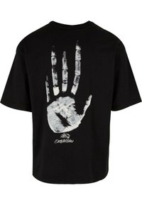 Sort bomulds t-shirt med et stort hvidt håndaftryk grafisk design på ryggen, der viser detaljerede fingre og håndflade tekstur.