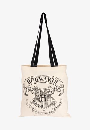 Cotton tote bag with black straps, featuring a printed Hogwarts crest design in black on a beige background. Text includes "Draco Dormiens Nunquam Titillandus."