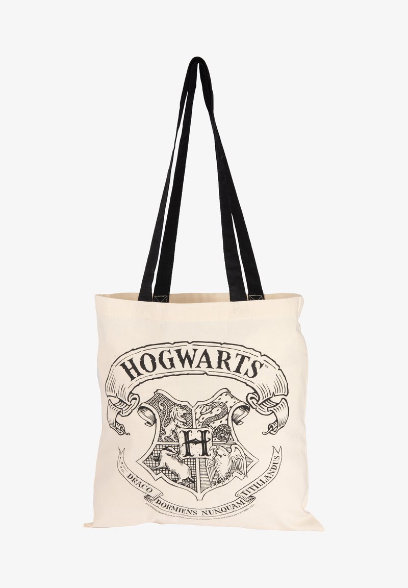 Cotton tote bag with black straps, featuring a printed Hogwarts crest design in black on a beige background. Text includes "Draco Dormiens Nunquam Titillandus."
