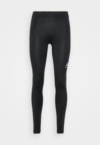 Leggings negros hechos de material elástico, con un diseño ajustado, textura suave y un pequeño logotipo en la parte inferior de la pierna.