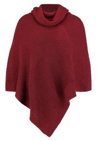 Poncho bordeaux en maille avec une texture côtelée, présentant un ourlet asymétrique et un col roulé ample.
