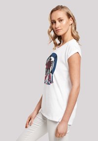 White cotton t-shirt featuring a multi-colored graphic print with a circular design, short sleeves, and a relaxed fit.