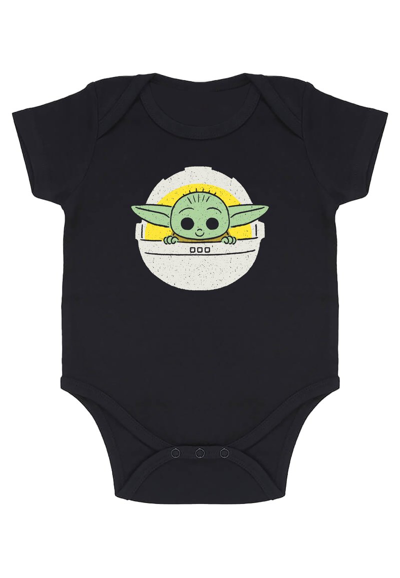 Svart babybody med en grafisk design av en grön, tecknad karaktär med stora ögon och öron, omgiven av en gul cirkulär design.