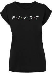 Svart t-skjorte med rullet ermer som har hvit tekst "P I V O T" og fargede prikker. Mykt stoff, avslappet passform og rund hals.