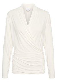 Long-sleeve, wrap-style top in soft white fabric, featuring a deep neckline and gathered texture on the front for a flattering fit.