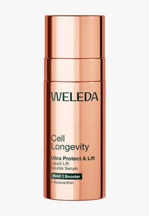 Różowo-złota cylindryczna butelka z etykietą Weleda Cell Longevity Ultra Protect & Lift Liquid Lift Podwójne serum z NAD+ Booster i astaksantyną.