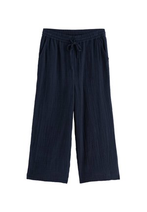 Marineblauwe wijde broek met elastische tailleband en trekkoord, voorzien van zijzakken en lichtgewicht gestructureerde stof.