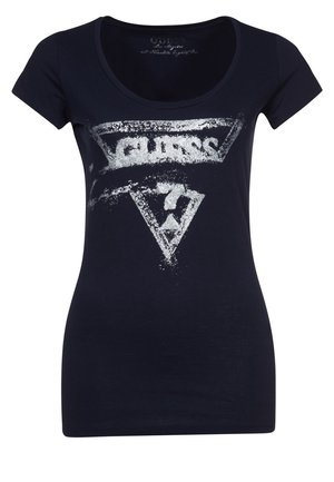 T-shirt noir ajusté avec logo "GUESS" argenté vieilli et graphique en forme de triangle à l'avant, manches courtes et col rond.