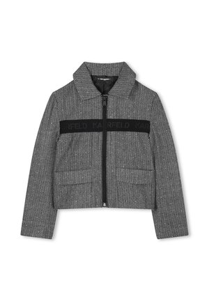 Veste courte avec un motif pied-de-poule noir et blanc, dotée d'une fermeture éclair et d'une taille noire avec le logo "KARLFED".