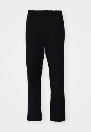 Pantalons noirs à coupe slim. Ils sont dotés d'une taille élastique et de jambes droites, fabriqués à partir d'un tissu lisse avec une finition mate.