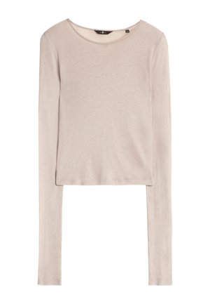 Top lungo a maniche lunghe color beige chiaro realizzato in un materiale morbido e leggero. Presenta un collo rotondo e un orlo uniforme, con maniche allungate.