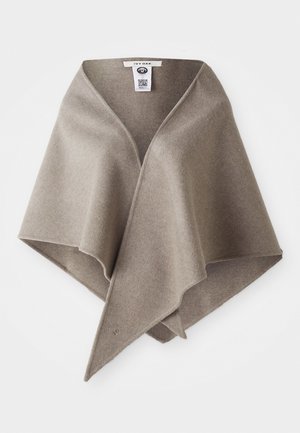 Soft brown wool wrap with a V-shaped neckline and asymmetrical hem. Features minimal stitching and a small logo at the bottom corner.