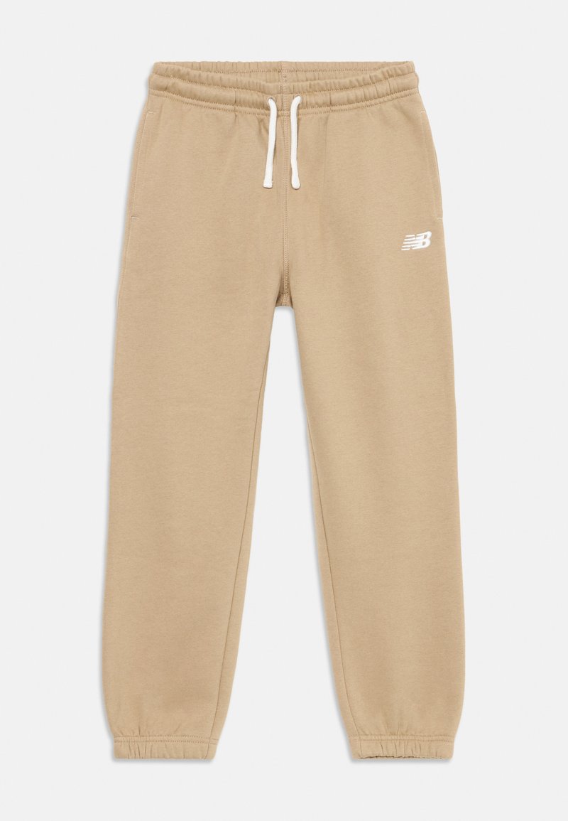 Beige Sweatpants mit elastischem Bund und Kordelzug. Mit Bündchen an den Knöcheln und einem kleinen weißen Logo an der Seite. Weiche Stofftextur.
