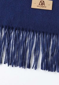 Navy blue wool scarf with fringed ends. Features a leather tag with "BELLEMERE" logo. Soft texture and warm material.