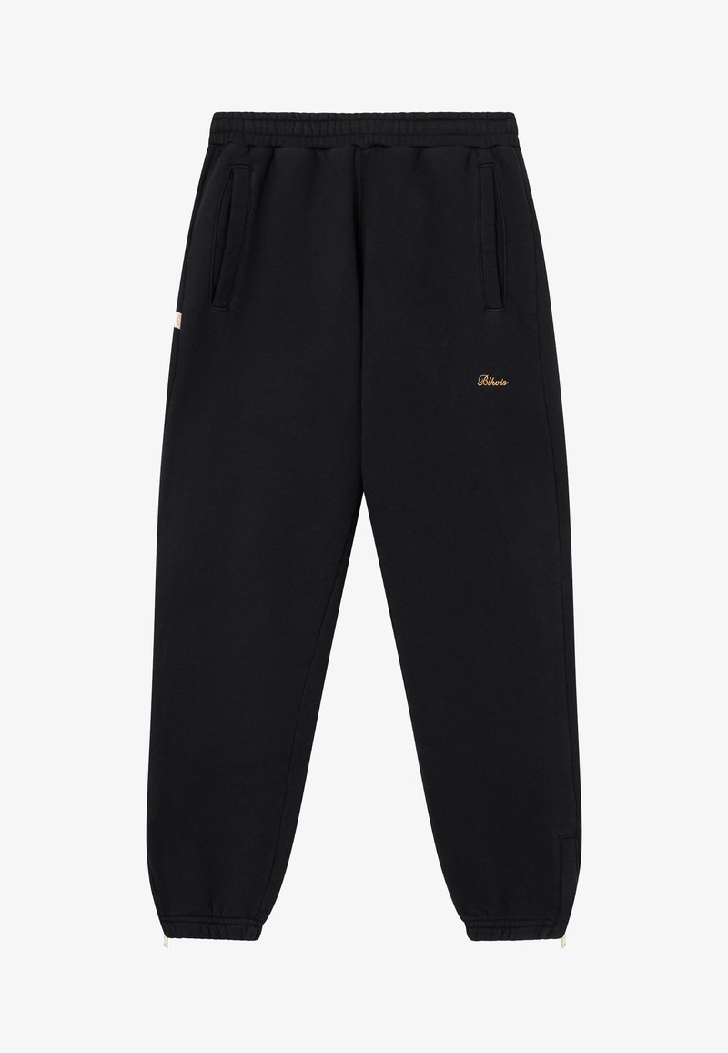 Schwarze Jogginghose aus weichem Material, mit einem elastischen Bund, seitlichen Taschen und einem kleinen goldenen Logo am Oberschenkel.