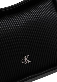 Calvin Klein Jeans MINI FLAP - Handbag - black