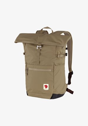 Brown roll-top backpack made of durable fabric, featuring adjustable straps, a front zip pocket, and a logo patch on the lower front.