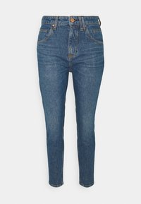 Modré džíny z denimu s tapered střihem, vysokým pasem a předními kapsami. Obsahují zapínání na knoflík a zip a mírné vyblednutí pro texturu.