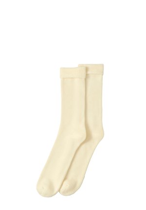 Ein Paar lange, cremefarbene Socken mit umgeschlagenen Bündchen aus weichem, geripptem Stoff, flach auf weißem Hintergrund dargestellt.