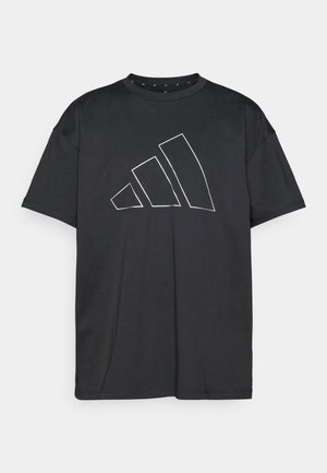 Μαύρο T-shirt από λείο ύφασμα με μεγάλο λευκό περίγραμμα λογοτύπου Adidas. Κοντά μανίκια και στρογγυλή λαιμόκοψη.