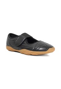 Black leather shoe with a rounded toe, quilted finish, and Velcro strap. Gum rubber sole provides traction and comfort.