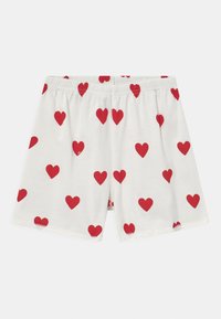 Pantaloni corti di cotone con una vita elasticizzata. Sfondo bianco con un motivo ripetuto di cuori rossi di diverse dimensioni.