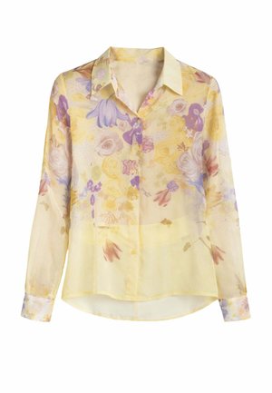 Camicia trasparente a maniche lunghe con bottoni, base gialla chiara e motivo floreale pastello in tonalità di viola, rosa e verde.