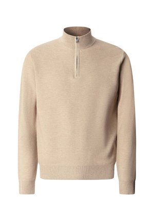 Bež pulover od pletenine s dugim rukavima i kratkim prednjim patentnim zatvaračem koji se proteže od ovratnika do prsa.