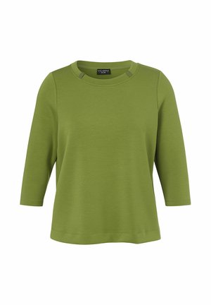 Green long-sleeve shirt with a round neckline and slightly cropped fit, featuring small decorative details near the collar.
