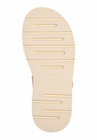 Ljust beige gummisula med horisontella spår för grepp. Märkt med "Tamaris" och storlek "37" pr Präglad på sidan.