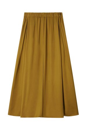 Jupe midi jaune moutarde avec taille élastique et plis souples créant une silhouette fluide.