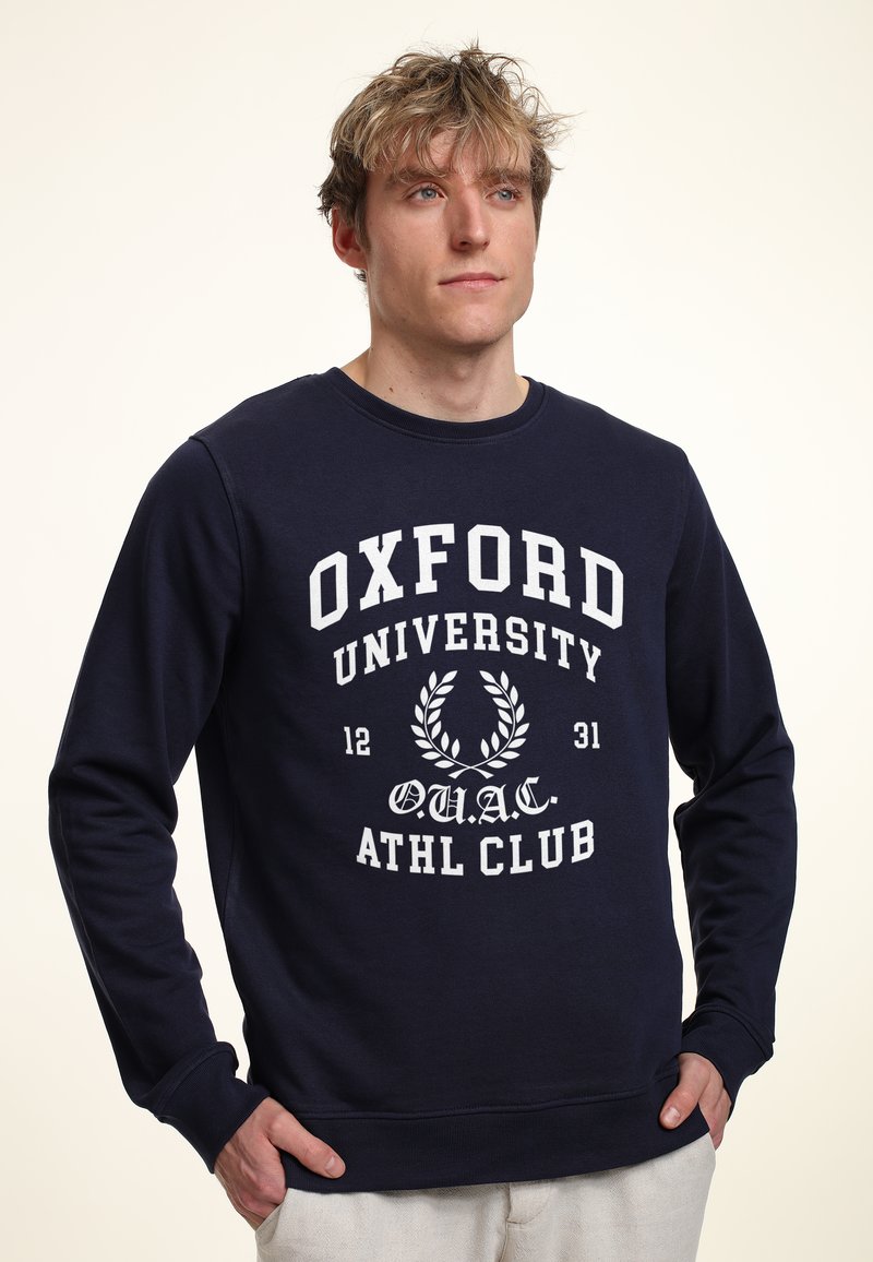 Navyblauwe sweatshirt van katoen, met witte bedrukte tekst "OXFORD UNIVERSITY" en laurierontwerp, ronde hals, ribgebreide manchetten en onderrand.