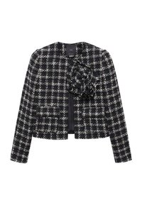 Veste en tweed à carreaux noir et blanc avec manches longues, deux poches à l'avant et un grand détail fleur en tissu sur la poitrine gauche.