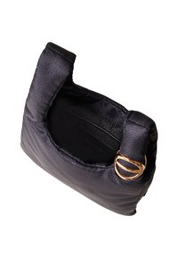 Small black textured handbag with padded handles and gold circular buckle detail, showing empty interior with visible brand label.