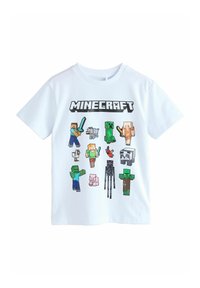T-shirt blanc à manches courtes avec des personnages de Minecraft dans des designs pixelisés. L'illustration comprend divers personnages et animaux à l'avant.