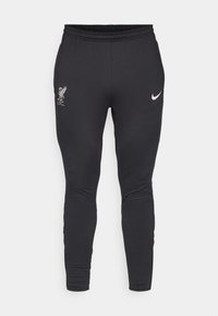  Sorte træningsbukser lavet af strækbart materiale, med et broderet Liverpool FC-logo og Nike swoosh, i en tætsiddende pasform og med elastisk talje.