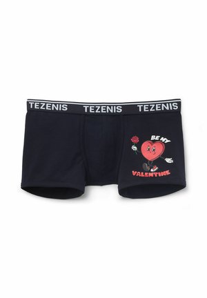 Bóxer de algodón en color marino con cinturilla elástica etiquetada "TEZENIS." Presenta un gráfico de un personaje con forma de corazón sosteniendo una rosa y texto.
