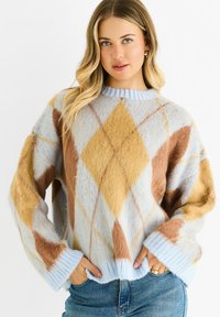 Knitted sweater in soft blue, featuring a diamond pattern in brown and ochre. Ribbed cuffs and hem with a round neck. Cozy texture.