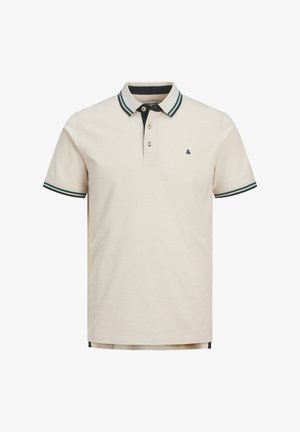 Beežist puuvillasest polo särgist tumesinise kaelusega, millel on rohelised triibud. Särgil on kolm nuppu liistul ja rinnal väike logo.