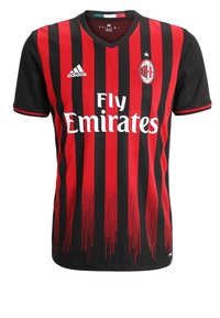 Mustapuna ja punaraidallinen jalkapallopaita lyhyillä hihoilla, V-pääntie, edessä "Fly Emirates" -logo ja seuran vaakuna rinnan alueella.