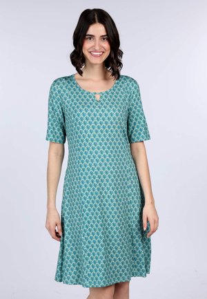 Kurzes türkisfarbenes Kleid mit kurzen Ärmeln, versehen mit einem Blättermuster und einem Herz-Ausschnitt. Hergestellt aus einem weichen, glatten Stoff mit fließender Silhouette.