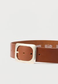 Brown leather belt with a wide silver square buckle, featuring uniform holes for adjustments and a smooth textured finish.