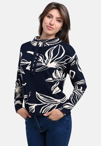 Marineblauer Pullover mit einem cremefarbenen Blumenmuster. Verfügt über eine Kapuze, lange Ärmel und eine lockere Passform. Weiches, strukturiertes Strickmaterial.