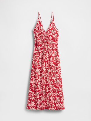 Vestido midi sin mangas rojo con patrón floral blanco y detalles fruncidos en el escote en V, exhibido sobre un fondo blanco.