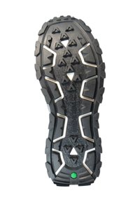 Semelle en caoutchouc noire avec des motifs de traction triangulaires, dotée d'accents blancs et d'un détail vert au talon. Surface texturée pour une meilleure adhérence.