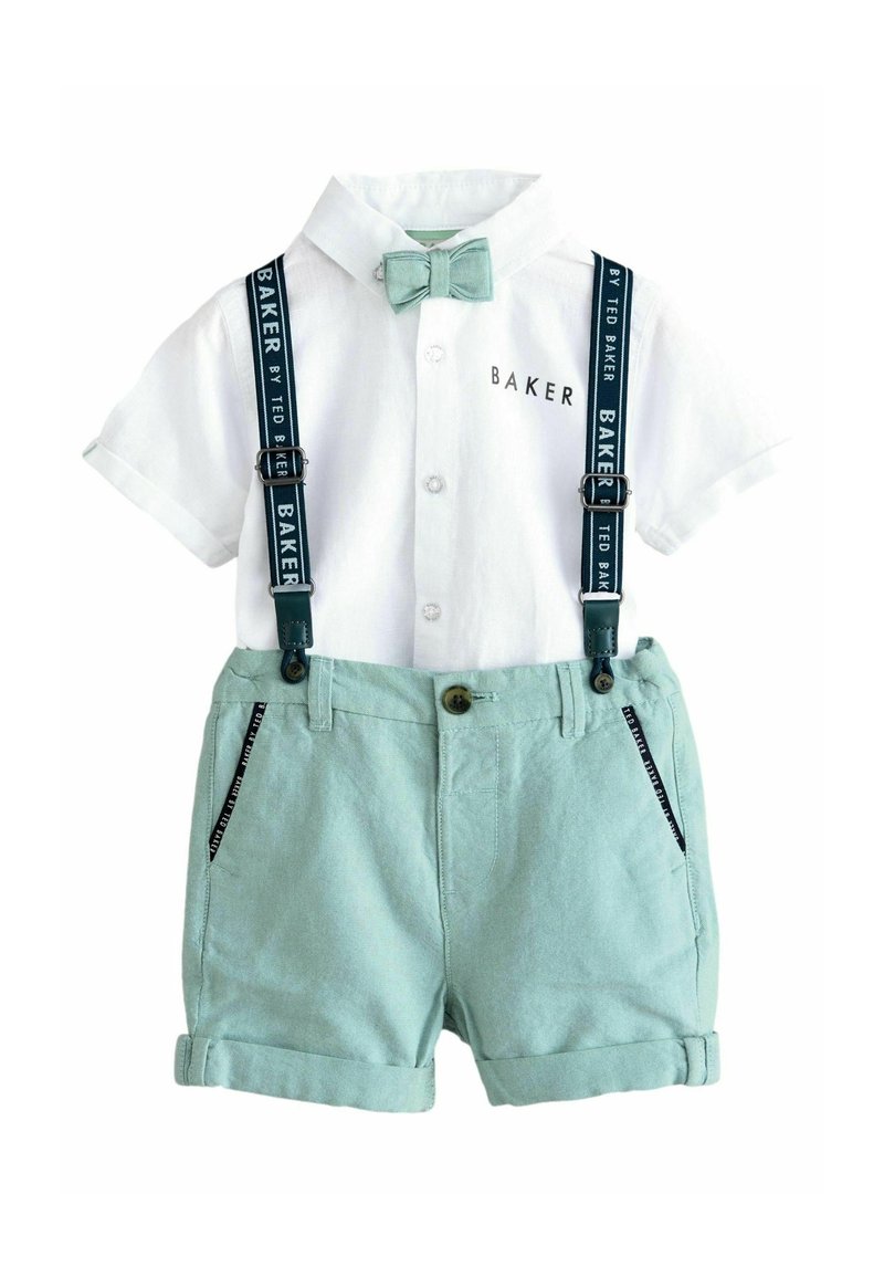 White collared shirt with a green bow tie, paired with light green shorts and navy suspenders featuring logo accents and a pocket detail.
